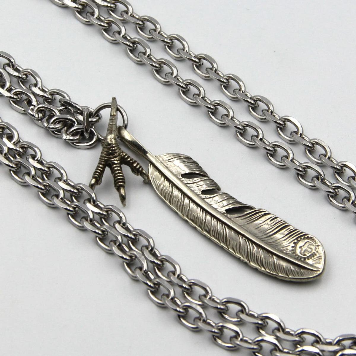 Stainless steel feather pendant sales
