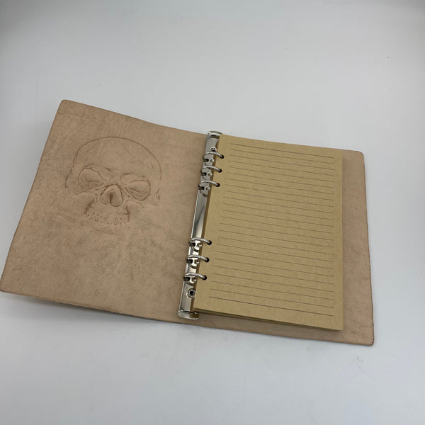 From Hide to Legacy–Artisan Made Leather Notebook with a Carved Skull