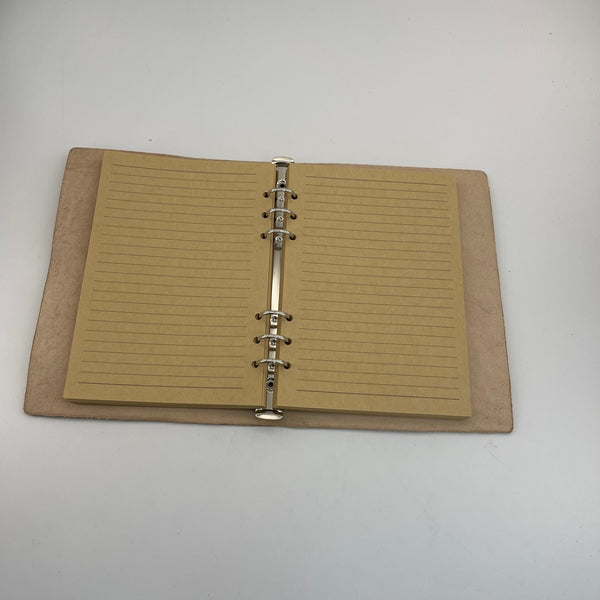 From Hide to Legacy–Artisan Made Leather Notebook with a Carved Skull
