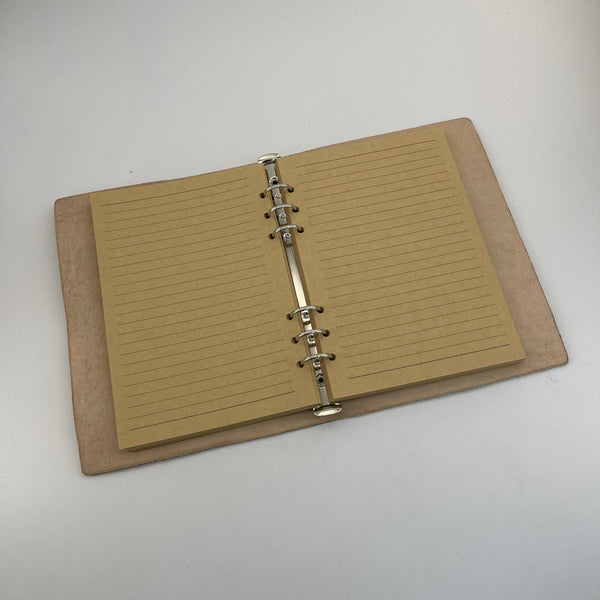 From Hide to Legacy–Artisan Made Leather Notebook with a Carved Skull