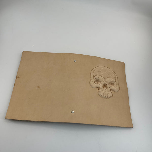 From Hide to Legacy–Artisan Made Leather Notebook with a Carved Skull