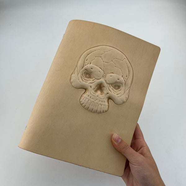 From Hide to Legacy–Artisan Made Leather Notebook with a Carved Skull